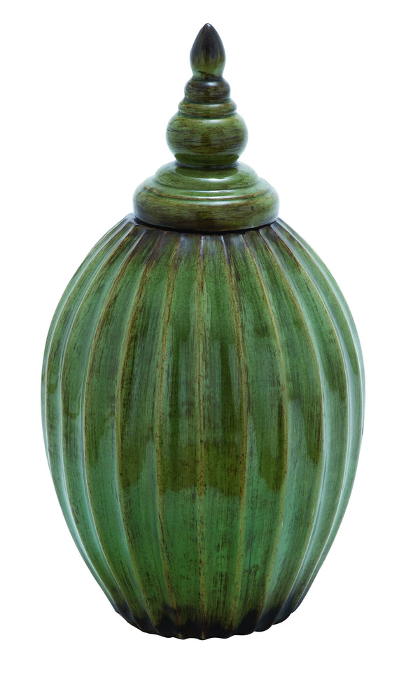 Beautiful Ceramic Jar with Rusted Accents on a Green Background