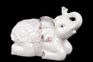 Sitting Ceramic Elephant with Raised Trunk Embellished with Beautiful Motif on the Back in White