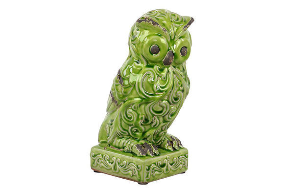 Attentive Ceramic Owl Figurine with Wide Open Eyes and Embellished with Beautiful Motifs on Stand in Green